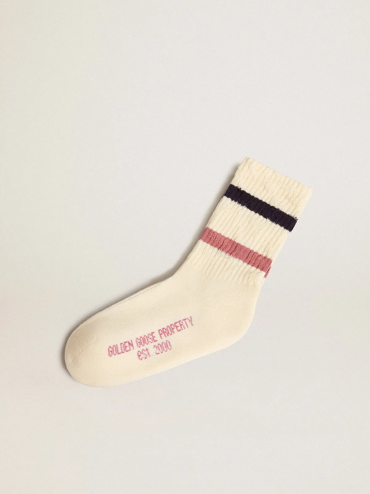 Worn white Kids socks with distressed details and two-tone lilac and blue stripes