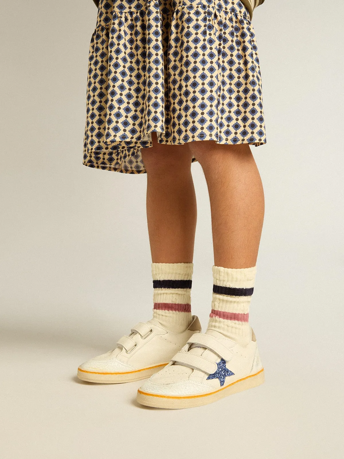 Worn white Kids socks with distressed details and two-tone lilac and blue stripes